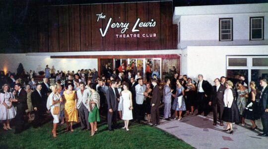 Hotel guests standing in front of The Jerry Lewis Theater Club