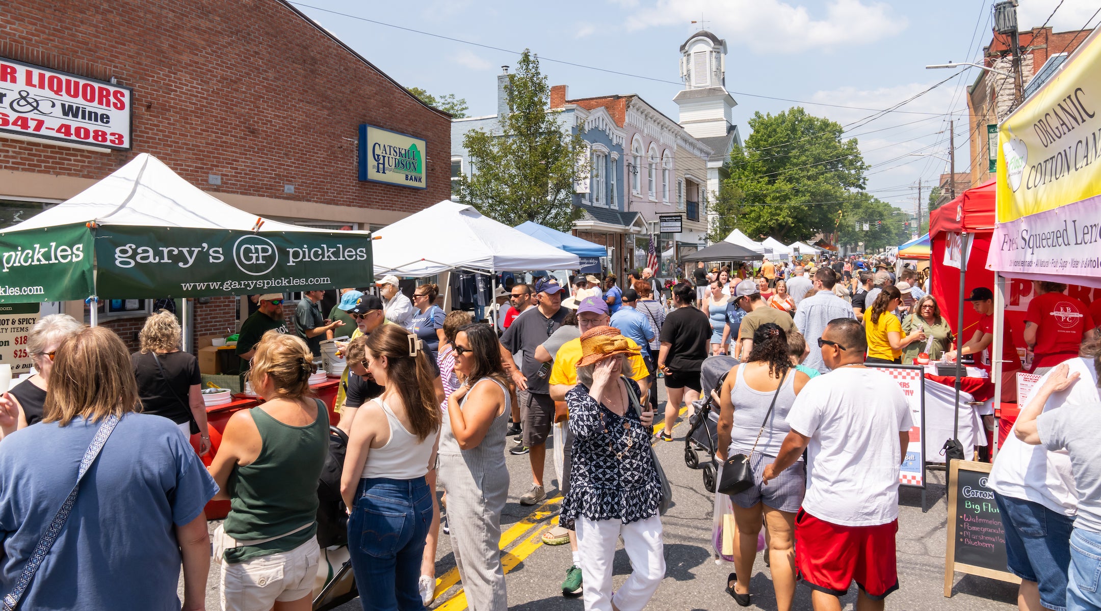 People walking around the street fair at the 2024 Borscht Belt Festival