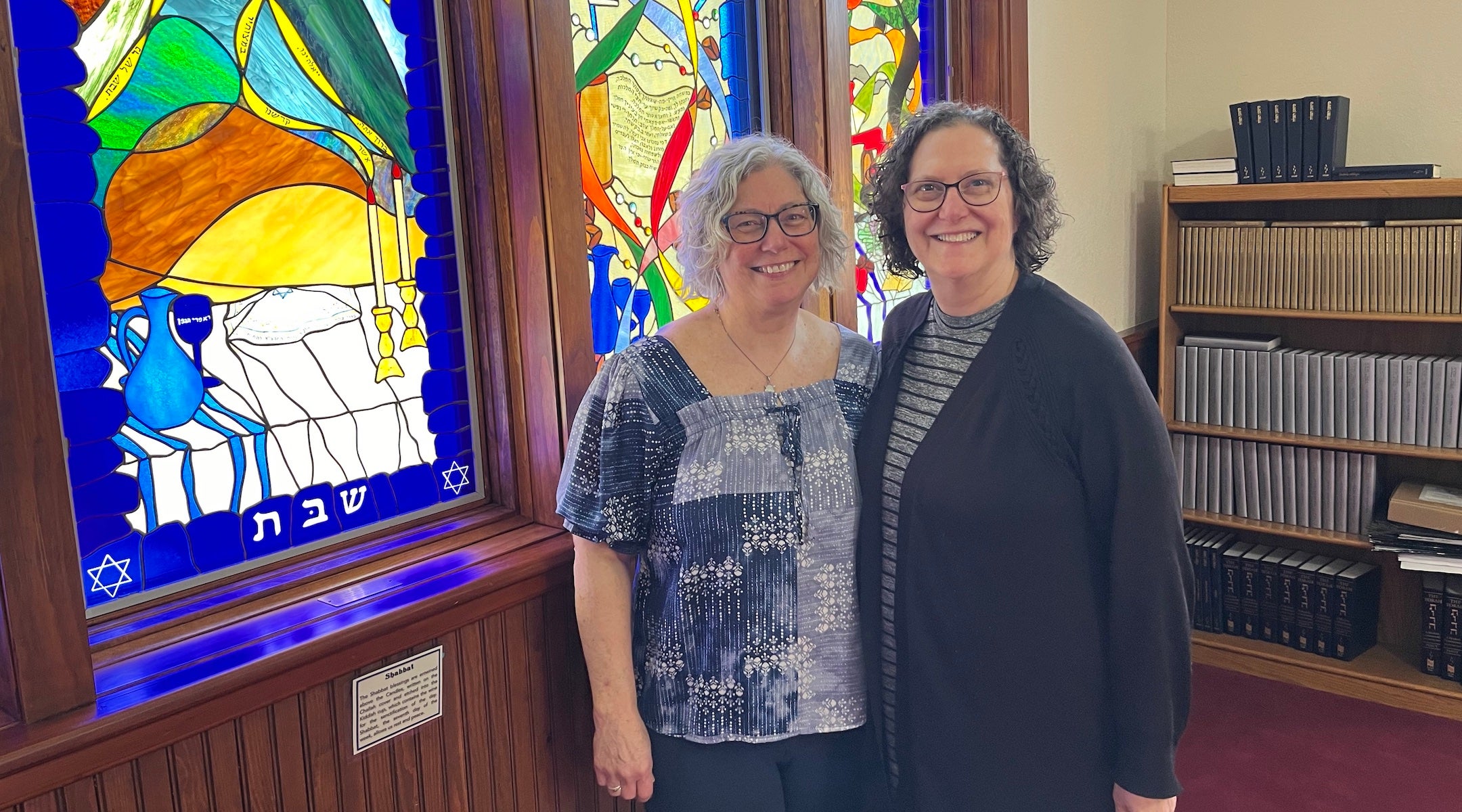 A rabbi and temple leader inside a synagogue