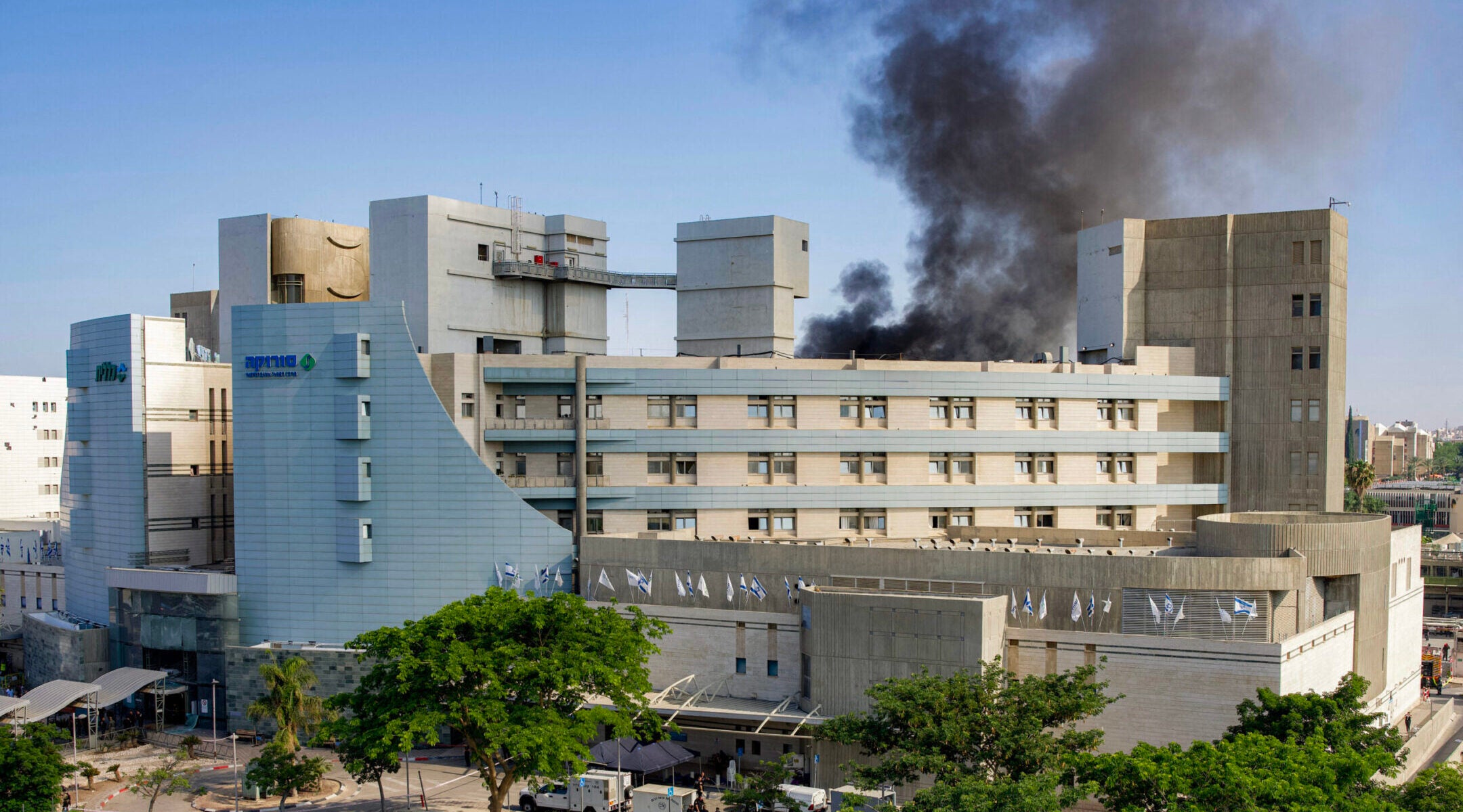 Iranian missile strikes Israeli hospital as Trump remains coy about whether US will intervene