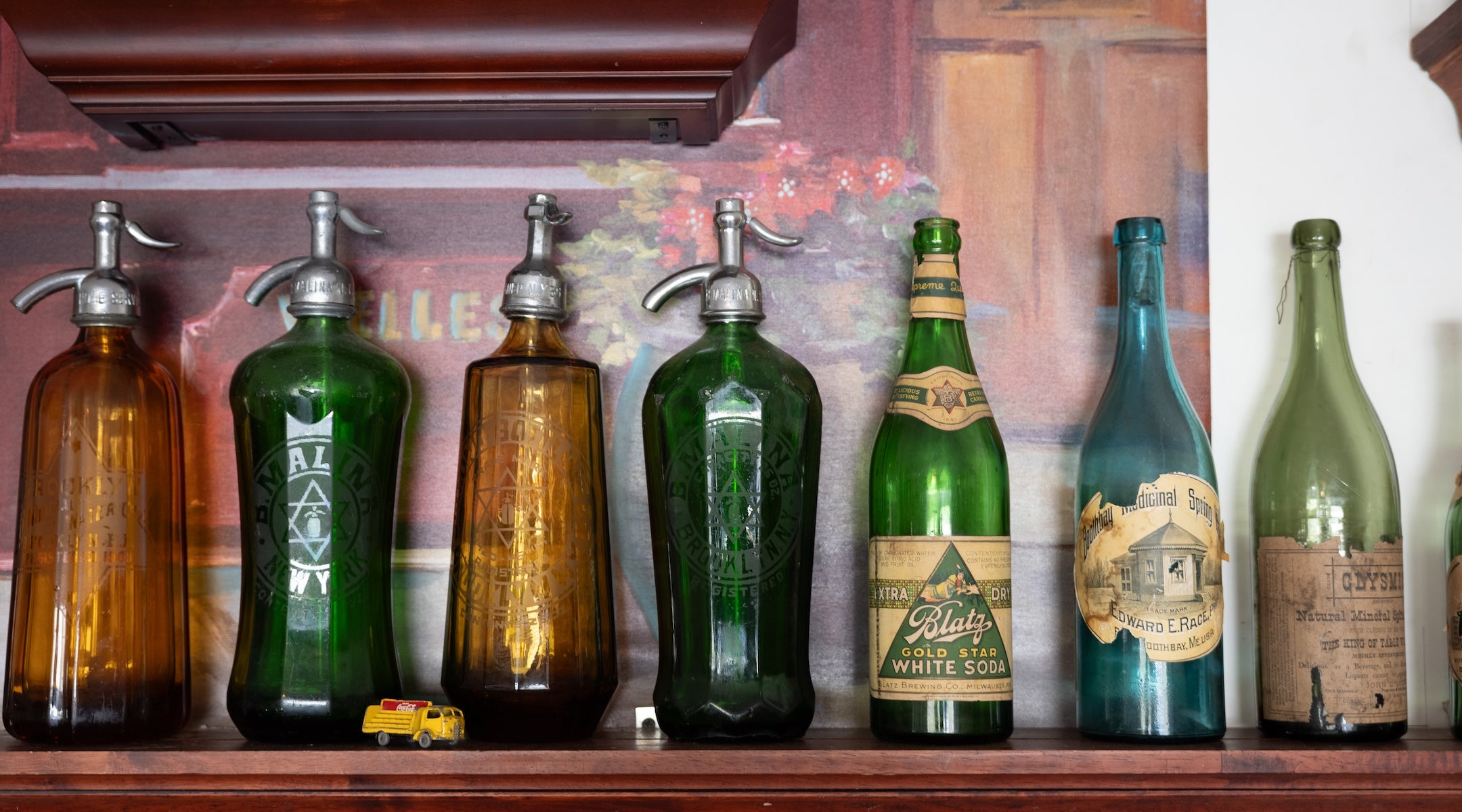 Seltzer bottles on shelf