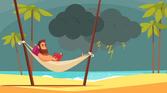 A man reading a book on the beach is interrupted by a sudden storm.