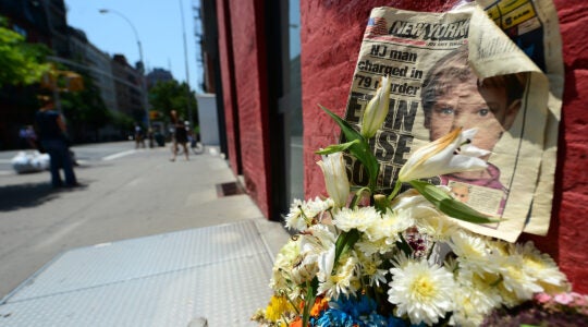 A photo of a crinkled newspaper with a photo of Etan Patz.