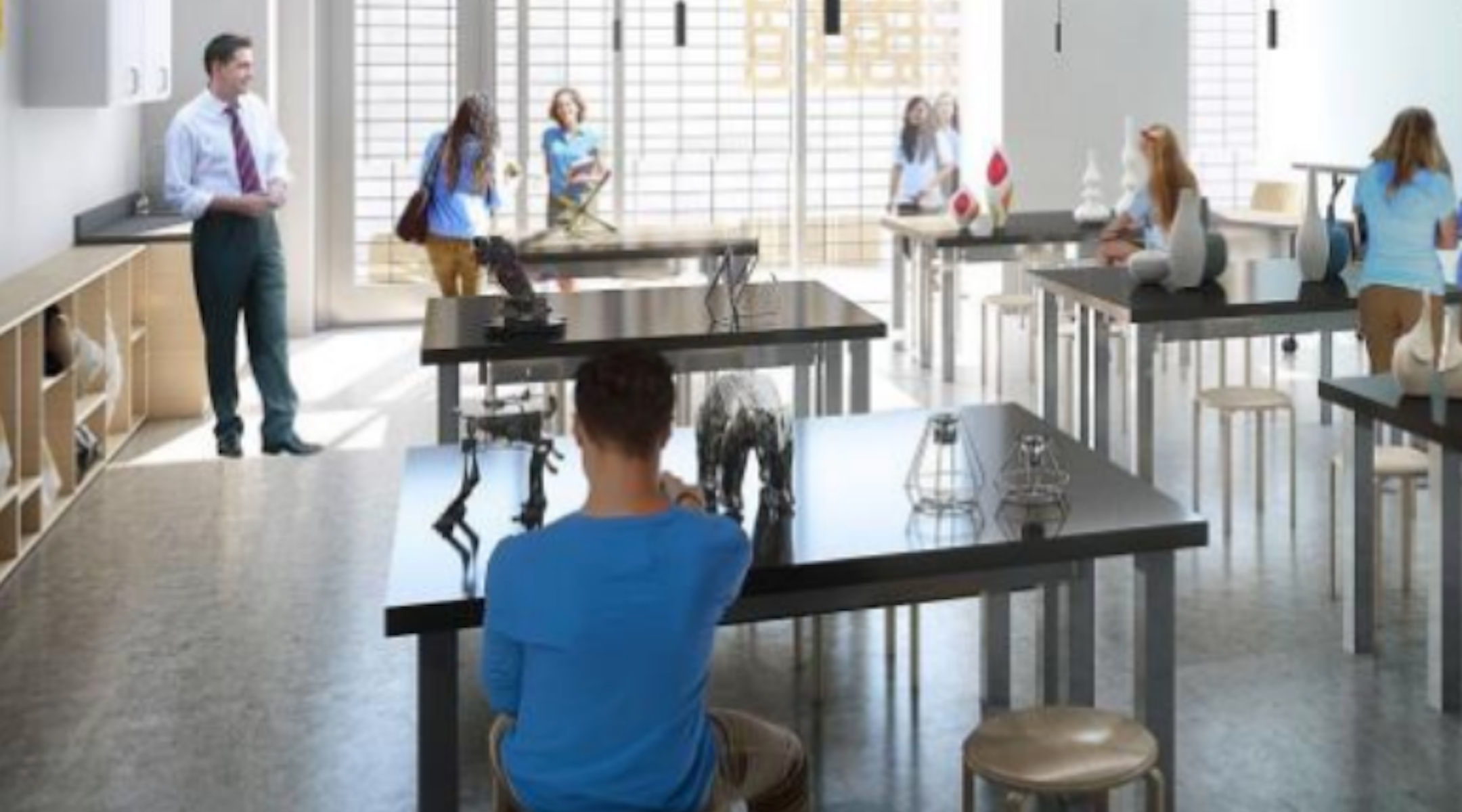 Students and a teacher in a classroom at the new Jewish high school.
