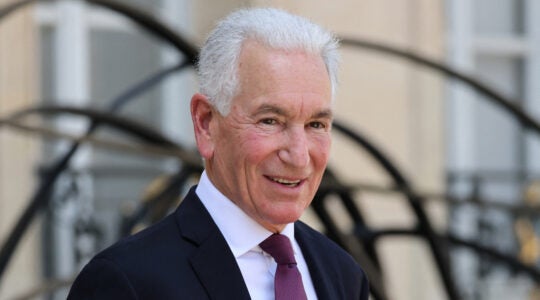 A photo of Charles Kushner wearing a suit.