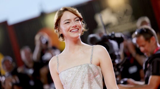 Emma Stone walks the red carpet in Venice