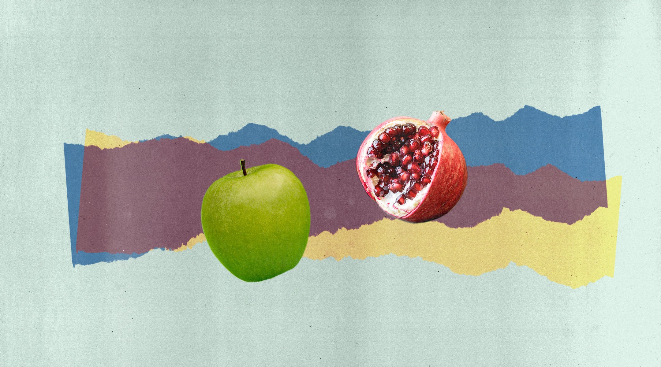 An apple and a pomegranate, two symbols of Rosh Hashanah. 