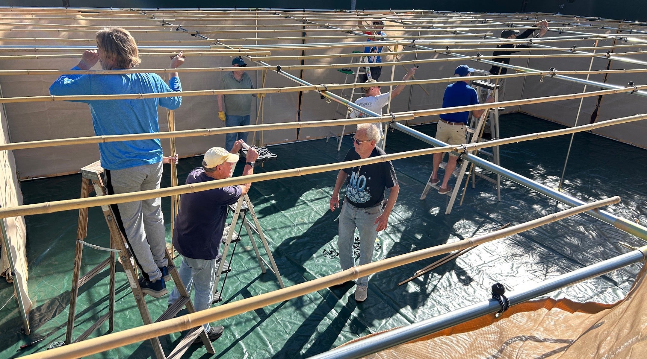 Men work t construct a sukkah.