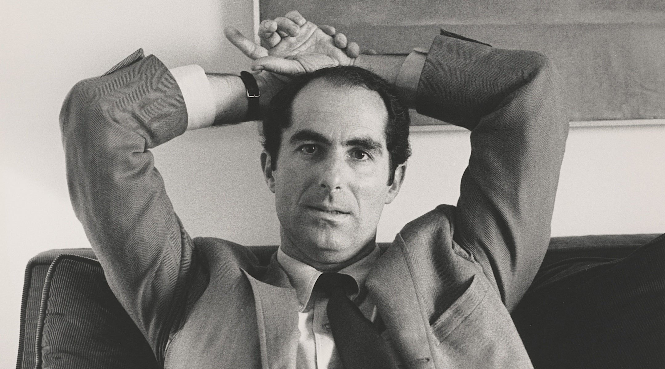 Jewish man with his arms over his head