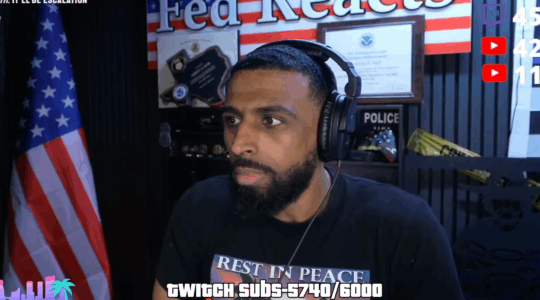A photo of Myron Gaines speaking into a mic.
