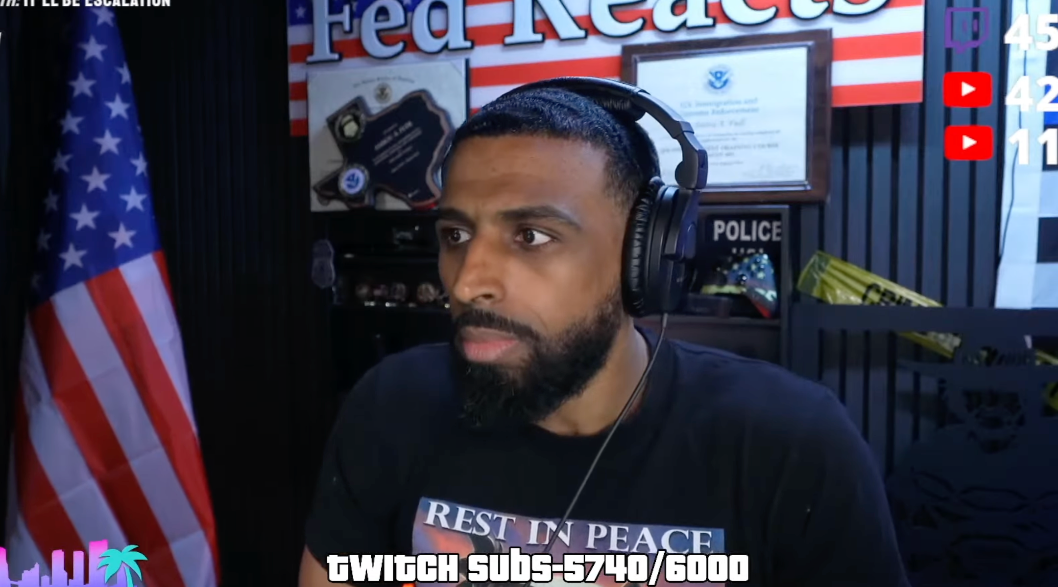 A photo of Myron Gaines speaking into a mic.