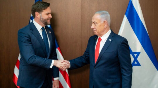 Netanyahu and Vance shake hands.